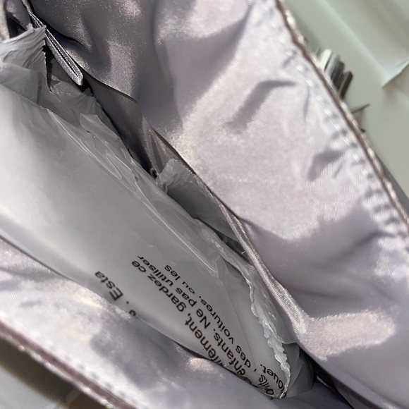 Chic wristlet with gold chain and tassel. - Picture 2 of 2